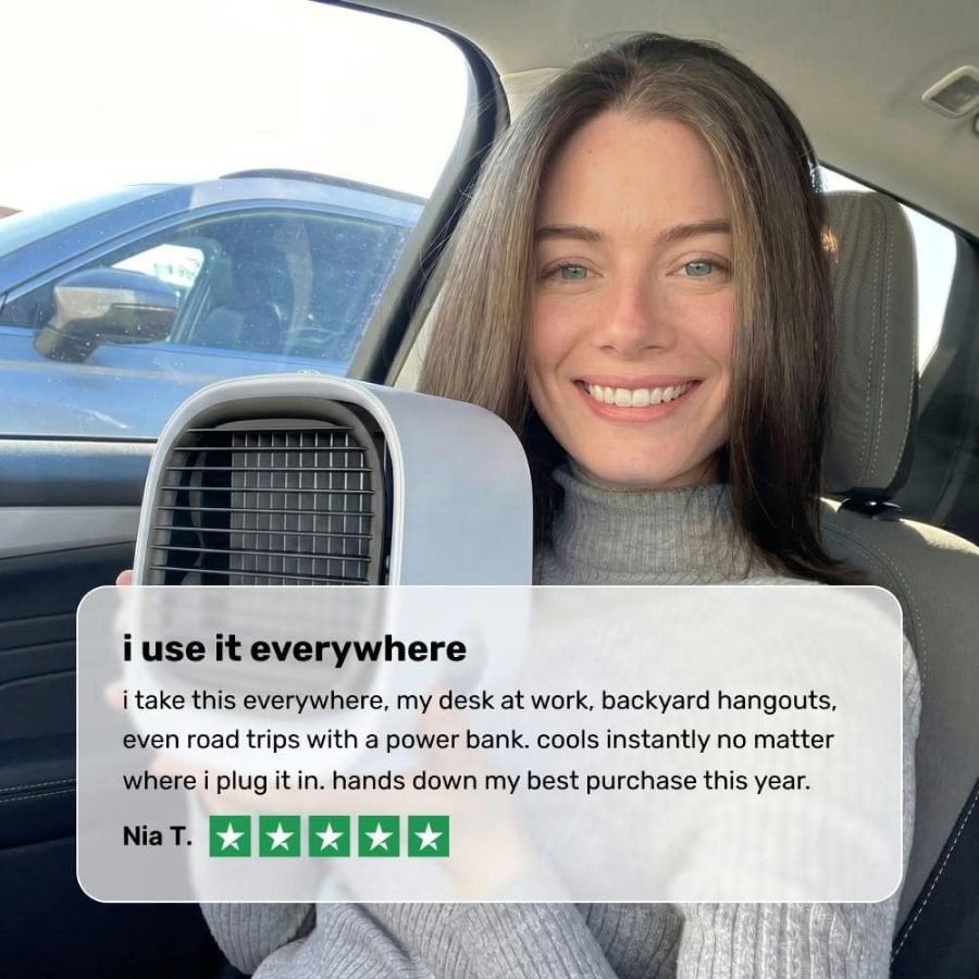 Woman using the AiraBreeze cooler in her car with a power bank